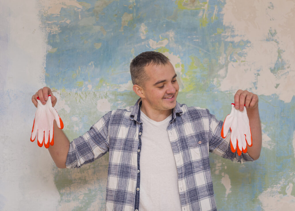 front-view-man-holding-looking-gloves